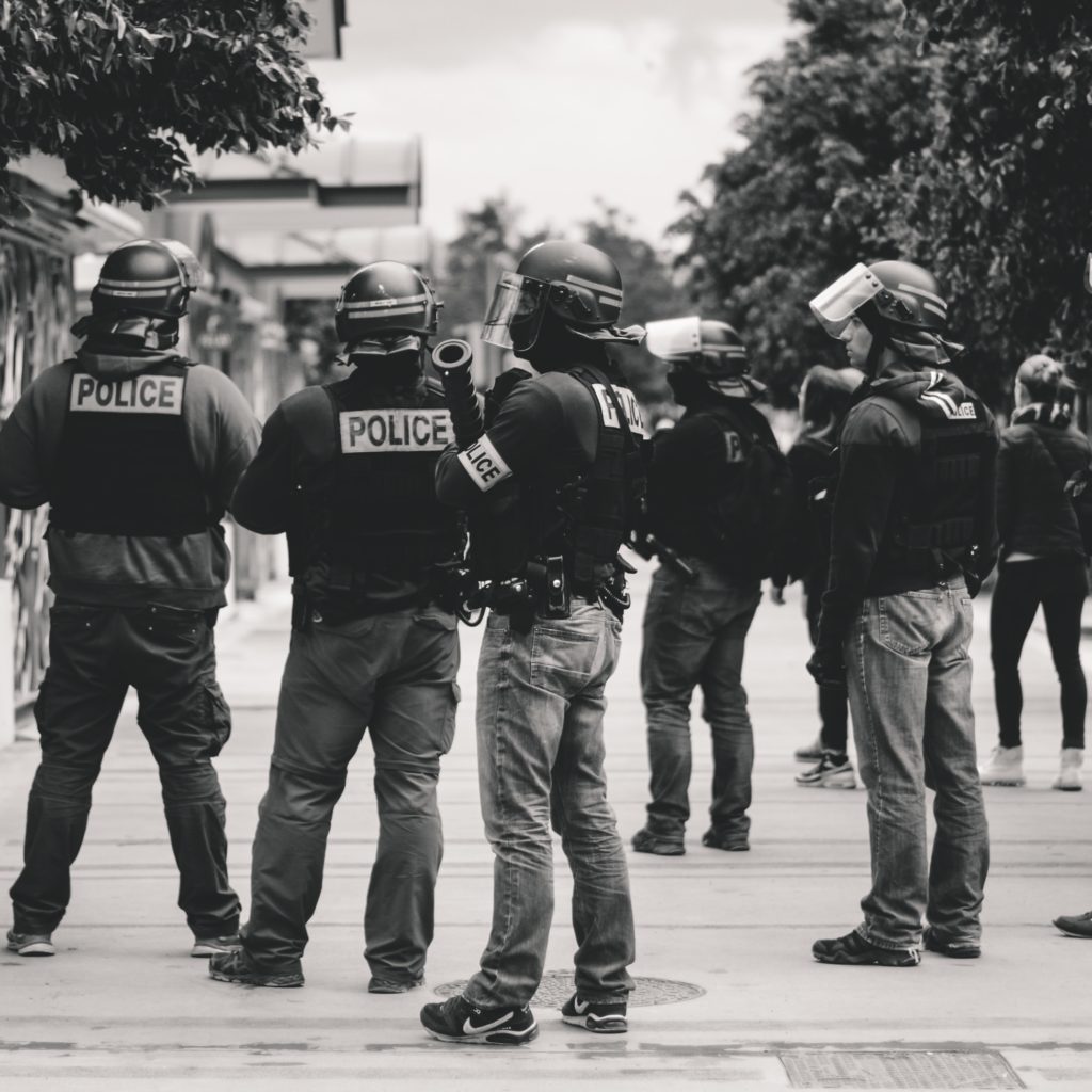 grayscale photo of police officers