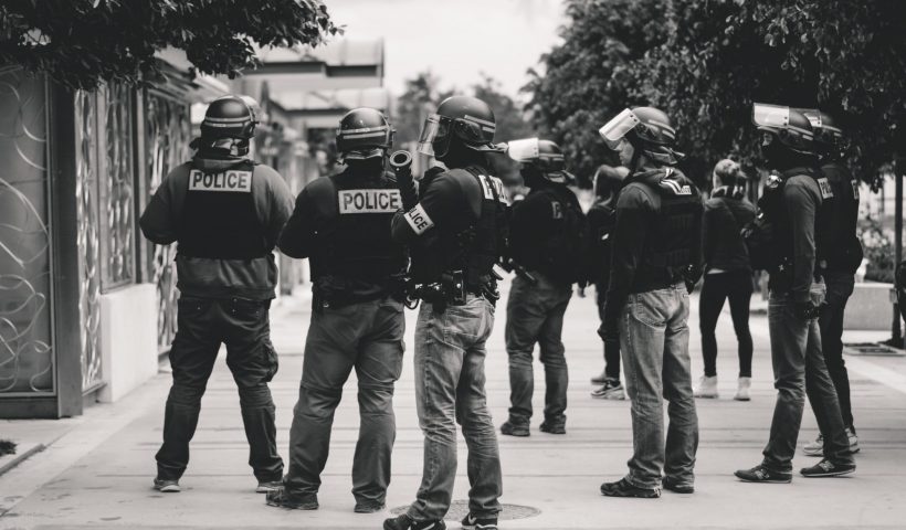 grayscale photo of police officers